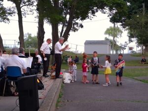 Audience and band during an outdoor concert
